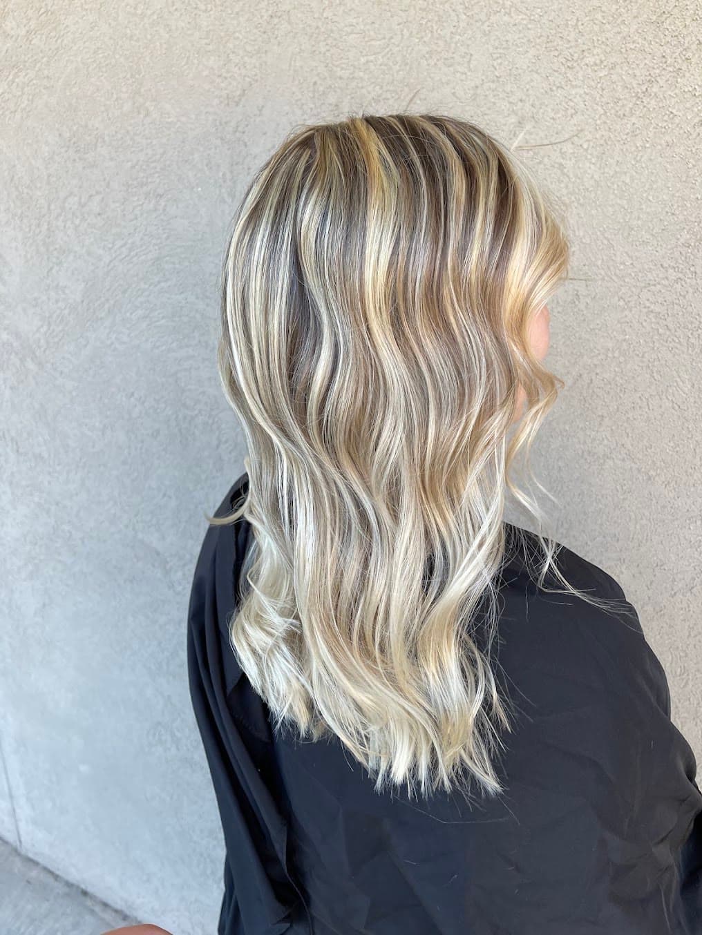 Dimensional blonde waves styled at Small Talk Salon